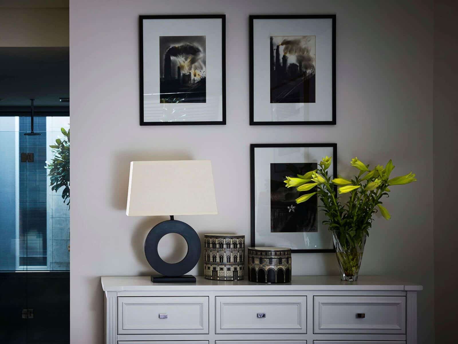 interior of a house with photo frames hanging on the wall